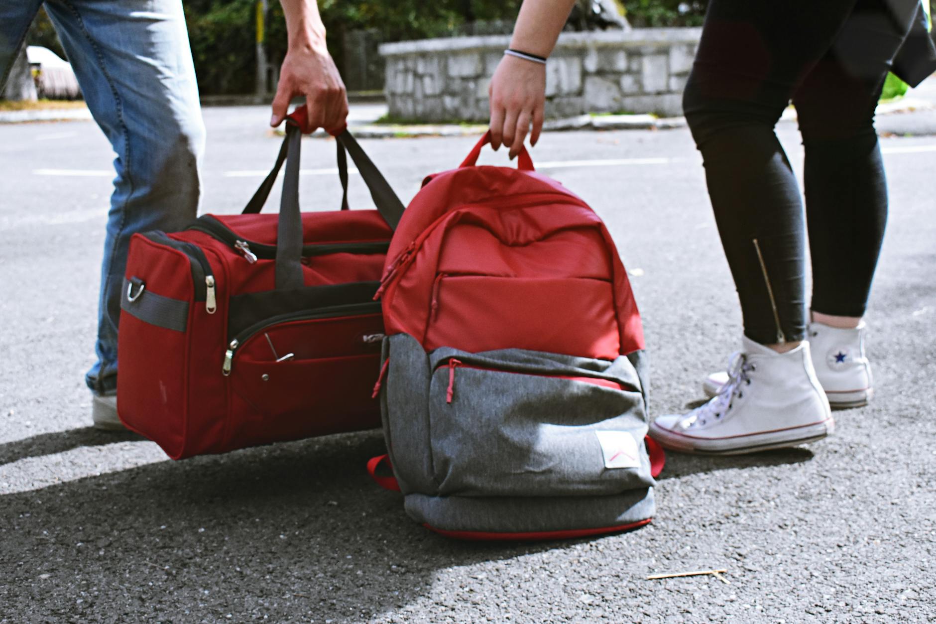 https://www.pexels.com/photo/two-person-carrying-duffel-and-backpack-1986996/