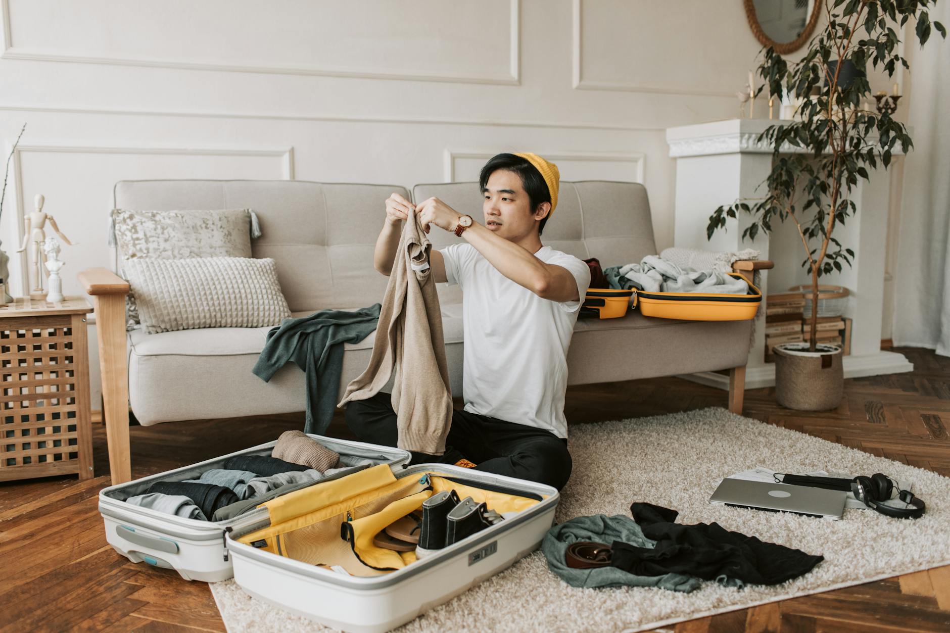 https://www.pexels.com/photo/a-man-packing-clothes-in-a-suitcase-7365327/