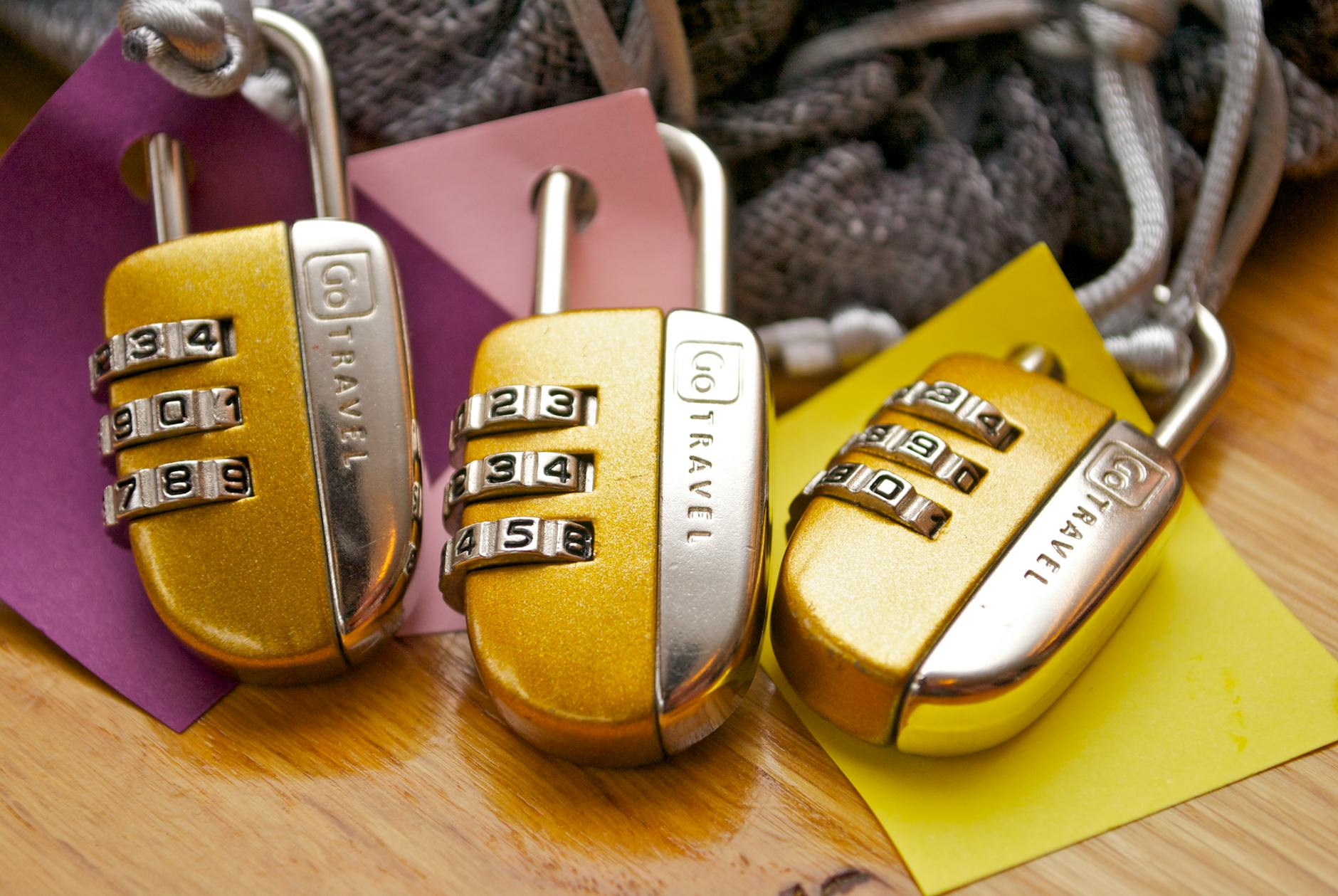 https://www.pexels.com/photo/three-gold-and-silver-combination-padlocks-943922/